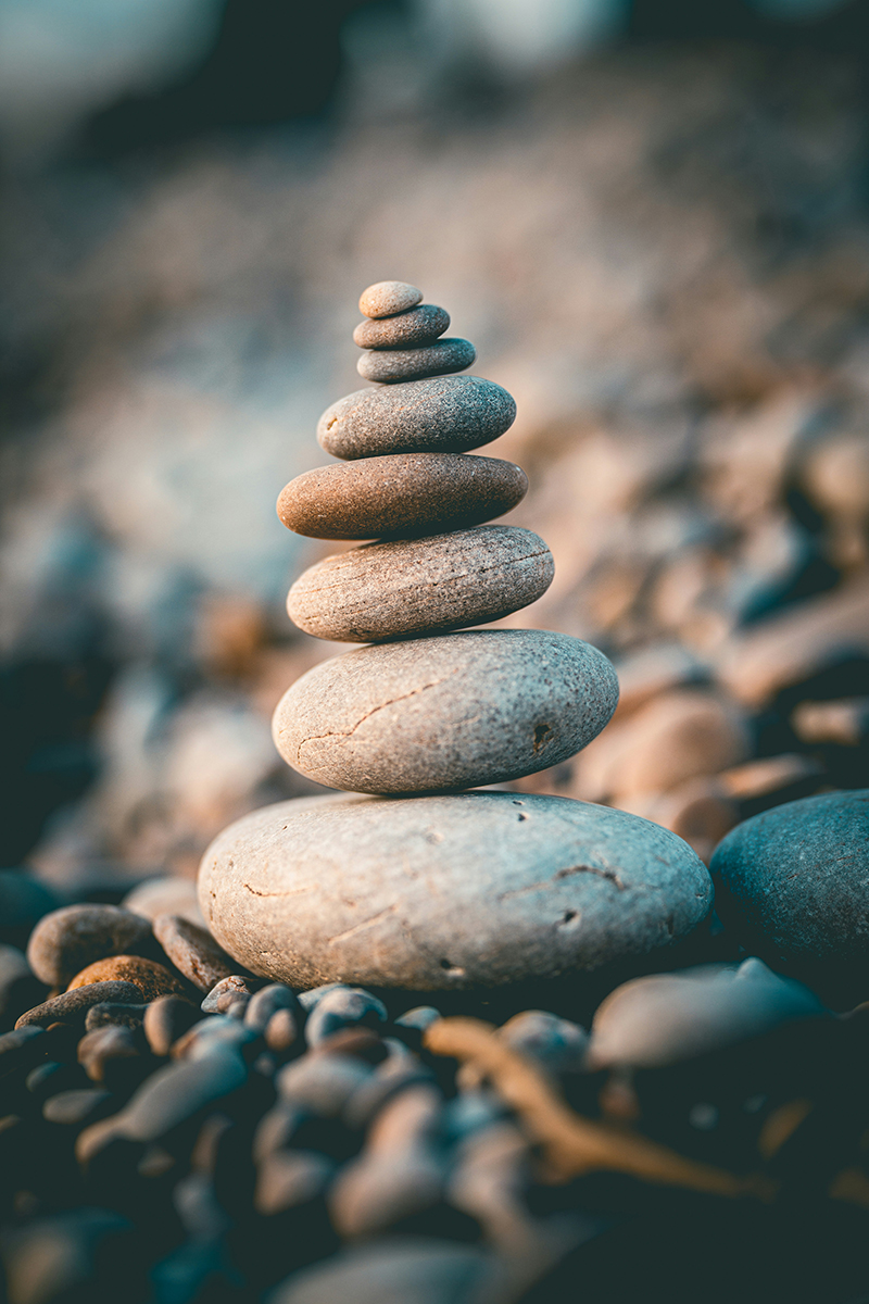 Balancing pebbles on a beach